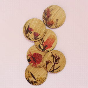 Set of six wooden coasters. Each coaster is a different coloured native flower of Australia.